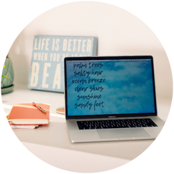 A laptop on a desk with the words life is better on it.